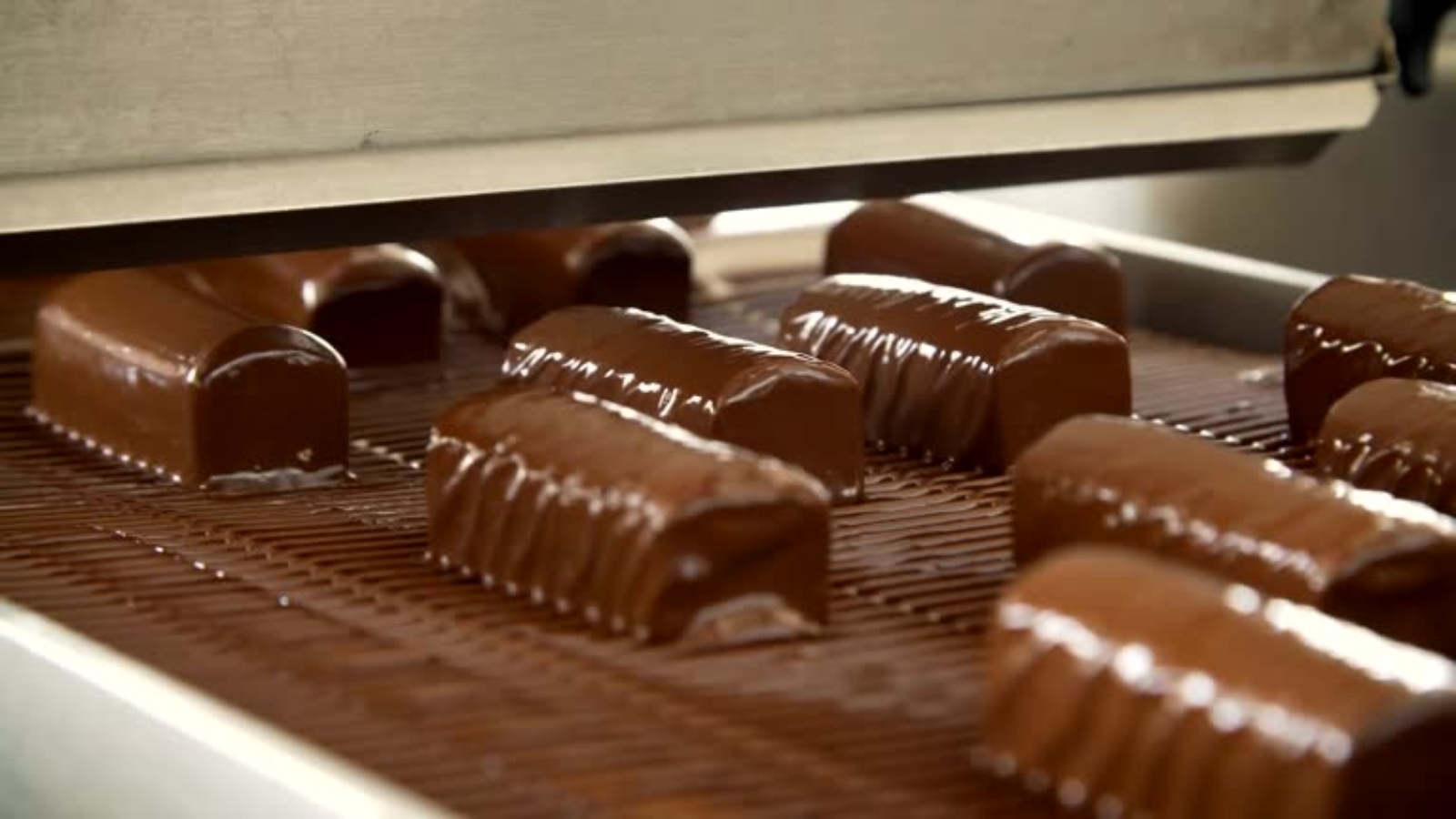 Production of chocolate sweets on the conveyor belt